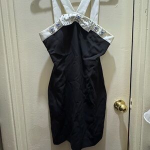 Elegant Black and White Dress with Embellished Neckline